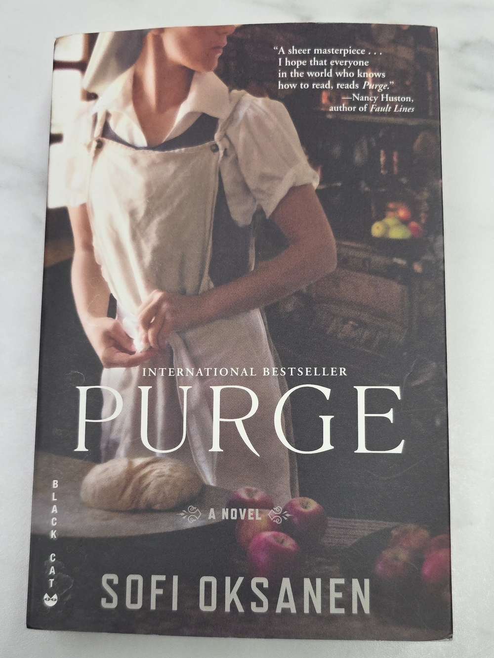 Purge by Sofi Oksanen — Paperback Novel in Cream/Brown Cover